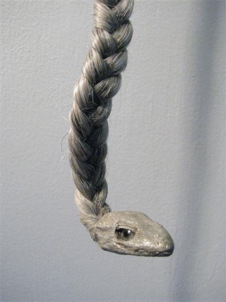<span>Eve (detail)</span><br />2014 - 40�&quot x 3�&quot x 7&quot - faux hair, lizard, glass eyes, spigot, mixed media