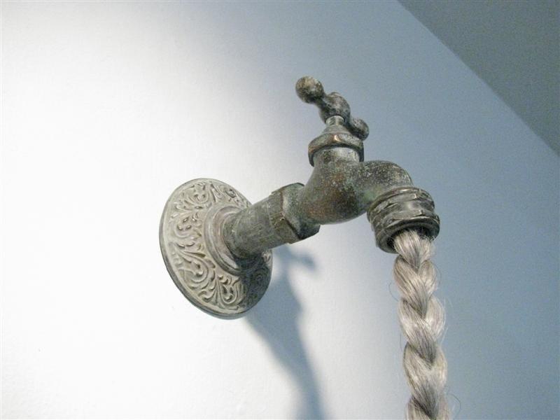 <span>Eve (detail)</span><br />2014 - 40�&quot x 3�&quot x 7&quot - faux hair, lizard, glass eyes, spigot, mixed media