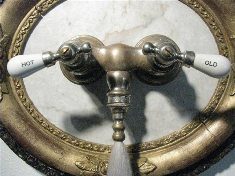<span>Hot And Old (detail)</span><br />2014 - 39&quot x 14&quot x 4&quot - faux hair, vintage frame, tub spigot, patinas, mixed media